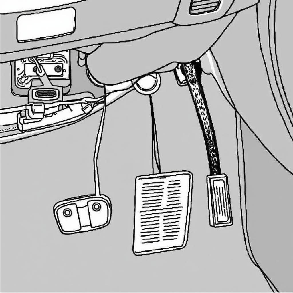 Close-up of car brake pedal with a switch