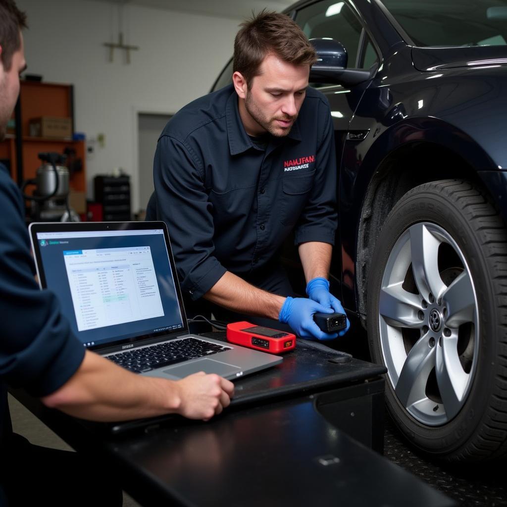 Mechanic using VAG COM 1551 to diagnose a car problem