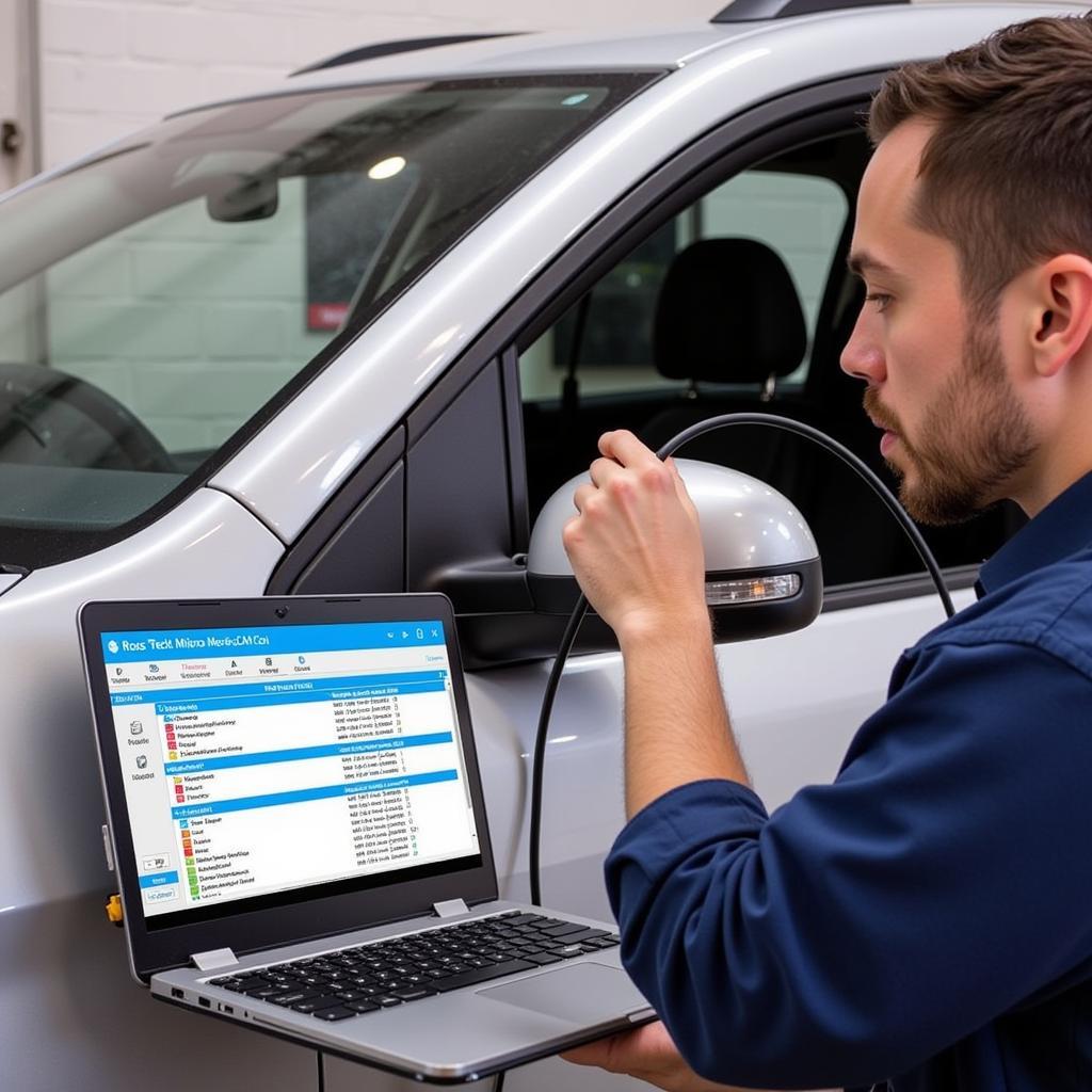 Mechanic using Ross-Tech Micro-CAN cable on car