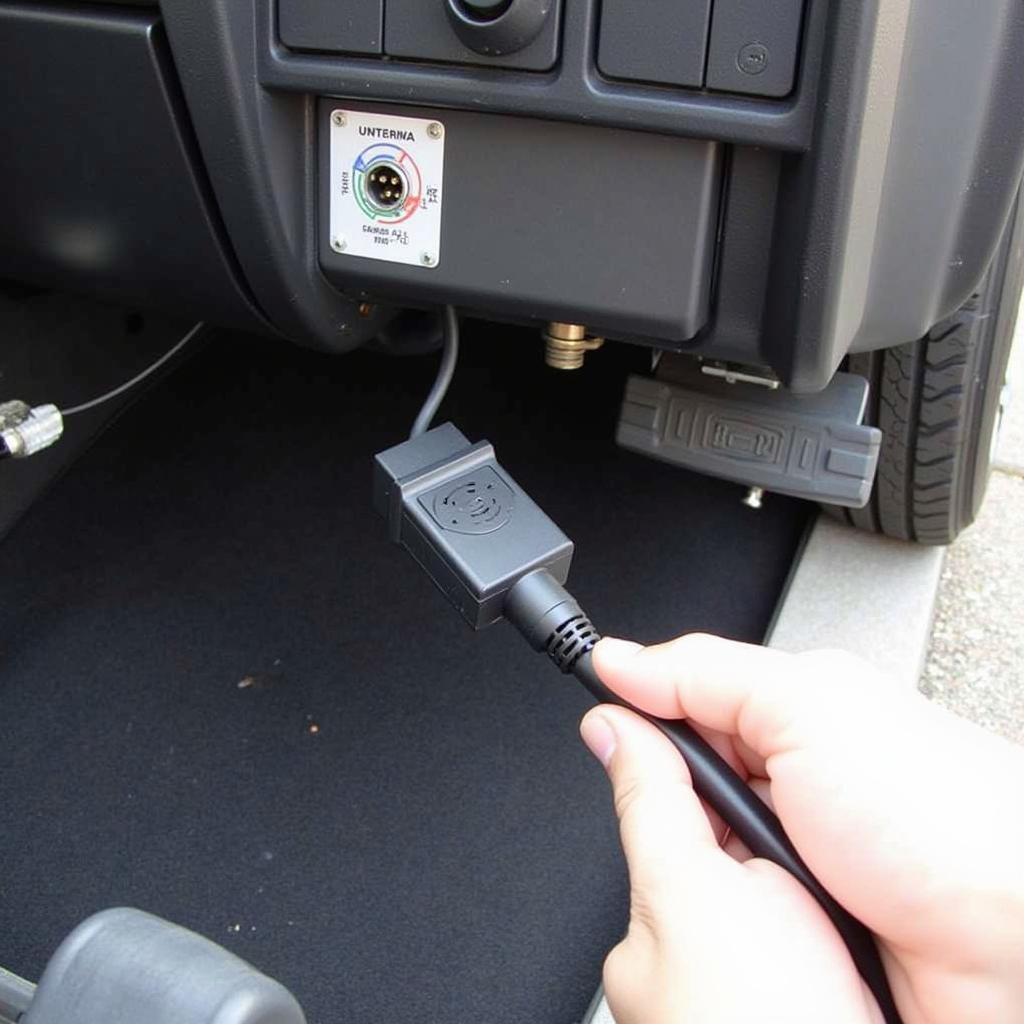 VCDS Cable Connected to Car's OBD-II Port