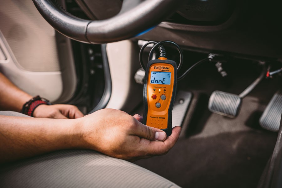 Locating the OBD2 port under the dashboard