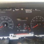 Chevy Suburban instrument cluster showing gauges at zero and warning lights.