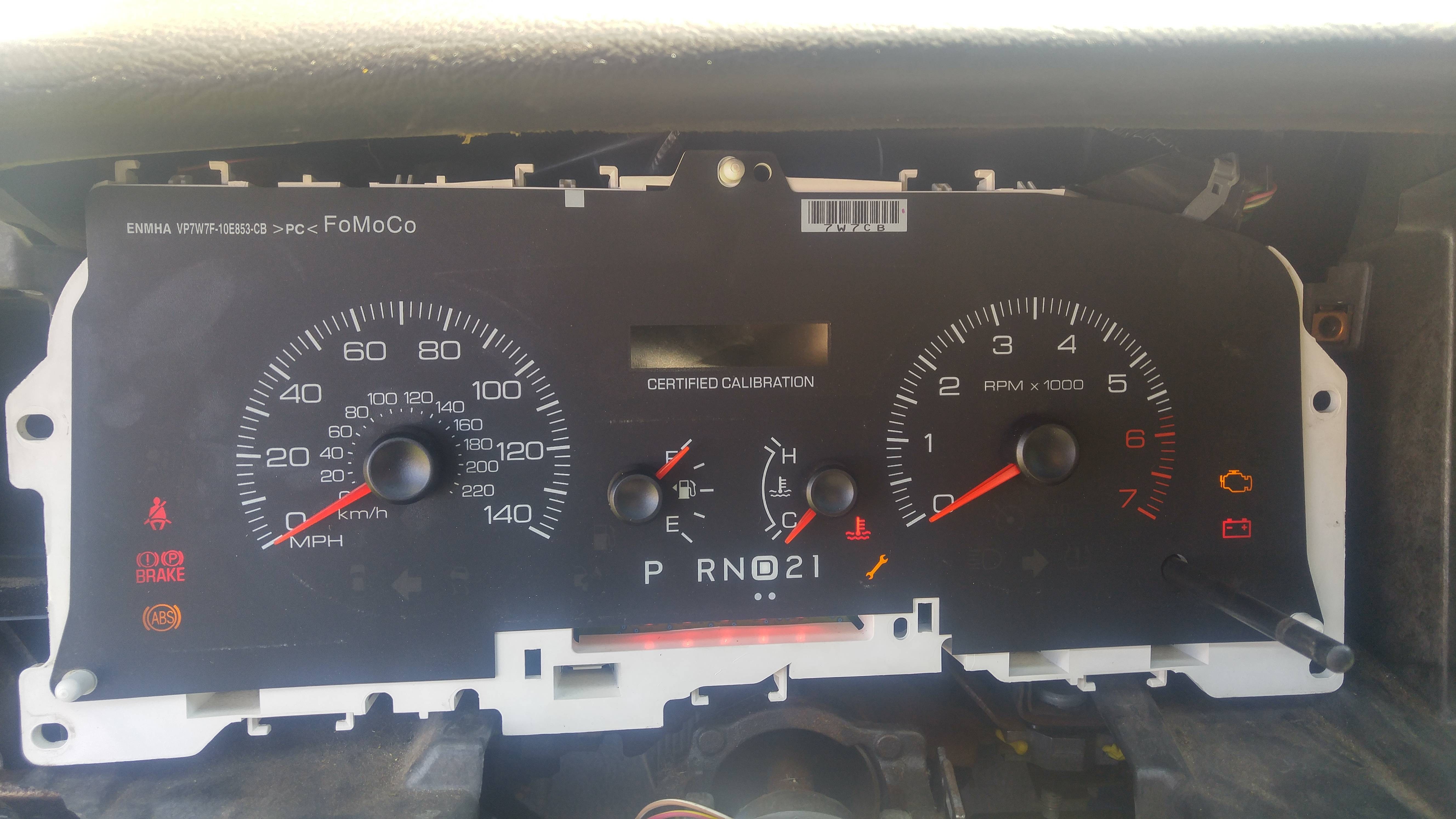 Chevy Suburban instrument cluster showing gauges at zero and warning lights.