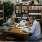 Researchers working with vintage car documents at the Horseless Carriage Foundation Inc. Automotive Research Library